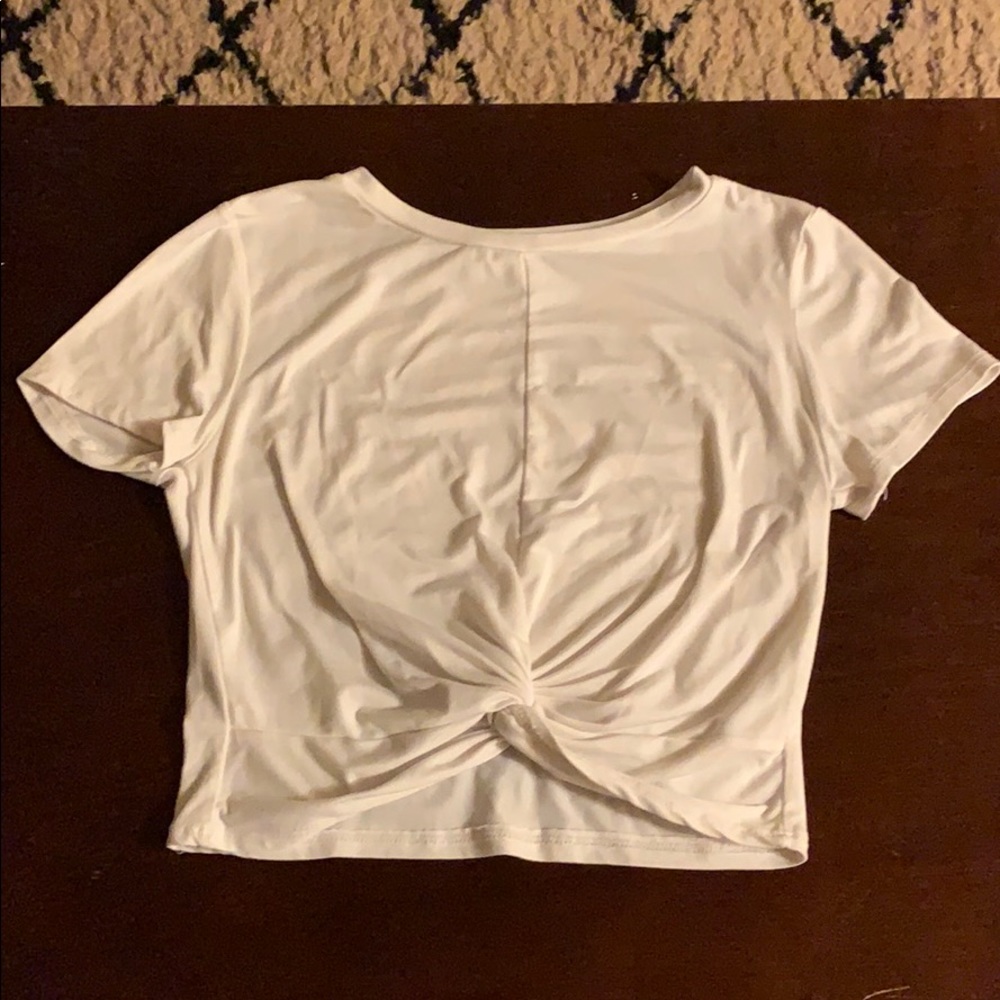 White shirt with a knot in the front